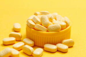 vitamin B tablets contains of Affro B on yellow background